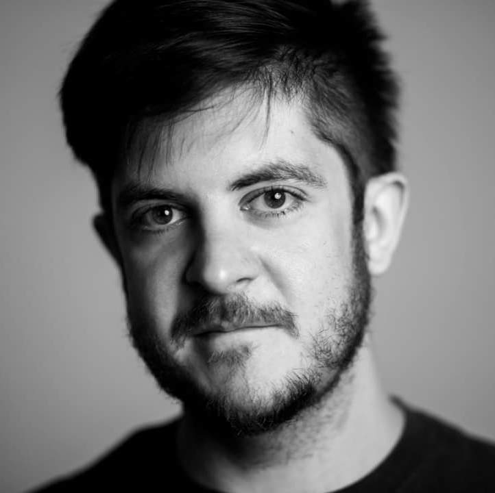 Black-and-white headshot of James Glenn